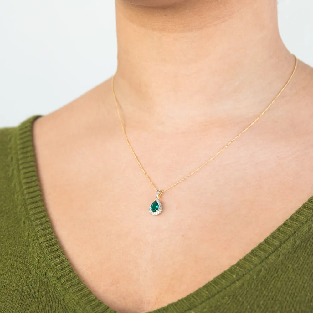 9ct Yellow Gold Created Emerald and 0.15 Carat Diamond Pear Halo Pendant on 45cm Chain Shiels